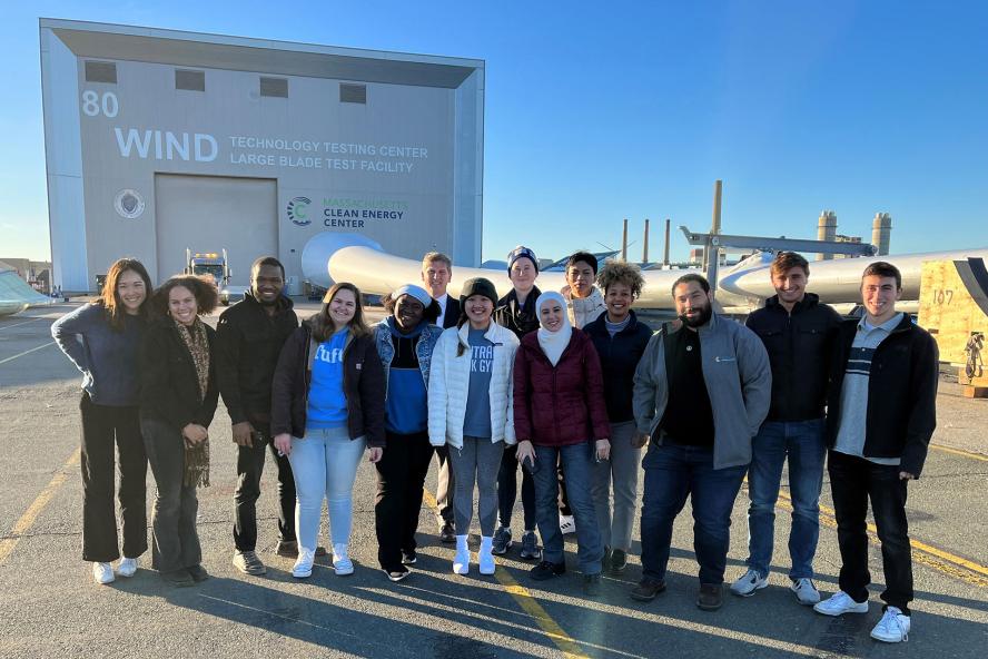 Tufts Offshore Wind students and faculty standing in front of the Wind Technology Testing Center